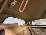 a view of the back seat of a car from the driver ' s seat