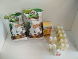 several bottles of liquid and a bag of liquid on a shelf