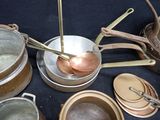 many pots and pans that are on the table