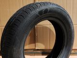a close up of a tire on a cardboard box on a floor