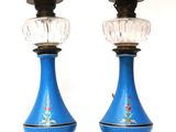 pair of blue glass lamps with gold trims on stands