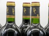 several bottles of wine are lined up in a row