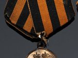 an image of a medal with a ribbon around it on a table