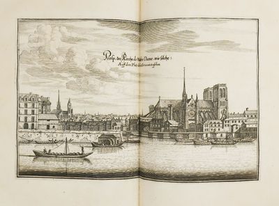 un livre ouvert sur lequel figure l'image d'une ville