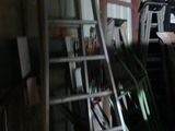 a ladder that is leaning against a wall in a garage