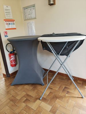 a table and chair in a room with wood flooring