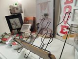 many items on a counter with a mirror in the background