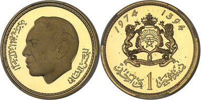 a close up of a gold coin with an image of a man ' s face