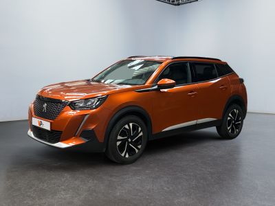 the orange suv is parked in a large room