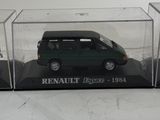 a small green van in a clear display case