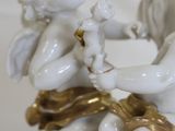 a figurine of two cherenshes playing with each other