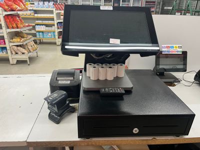 an image of a cash register machine in a grocery store