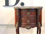 a small table with a marble top and a drawer on it