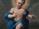 une image représentant un tableau d'un enfant avec une auréole sur la tête
