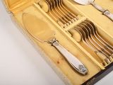 a box with silverware in it on a table