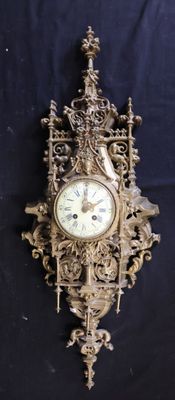 a clock that is on the wall with a bird on it