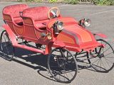 an old fashioned car that is parked in the parking lot