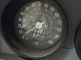 a close up of a speedometer on the dashboard of a car