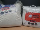 two bags of white pillows on a wooden table