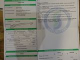 two papers are sitting on a table with a barcode on it