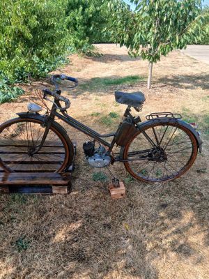 a bike that is sitting on the ground in the grass