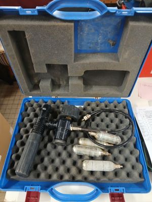 a blue case with tools inside of it on a table