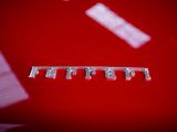 a close up of a row of toothbrushes on a red surface