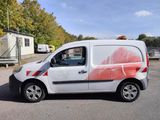 a white van with a red and white design parked in a parking lot