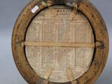 a wooden plate with a newspaper on it on a stand