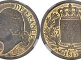 a close up of a coin with a crown on it
