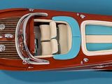 a model of a boat that is sitting on a blue surface