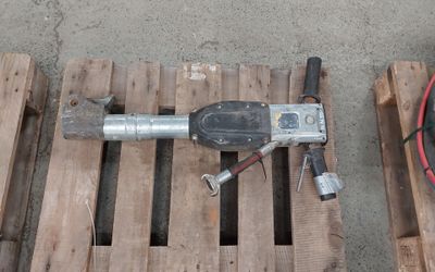 wooden pallets with tools on them sitting on top of them