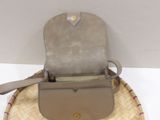 a purse that is sitting on top of a hat