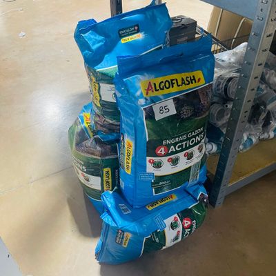 several bags of food are stacked on top of each other in a store