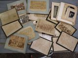 a lot of old photos on the table