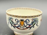 an image of a white bowl with blue and yellow designs on it