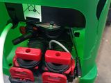 an image of a green and white container with a bunch of red and black wires attached to it