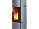 a metal stove sitting on top of a white surface