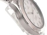 a close up of a watch on a white background