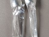 two spoons and a fork in a plastic bag