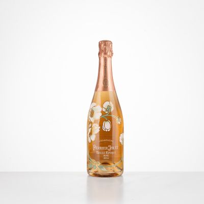 a bottle of champagne sitting on top of a white table