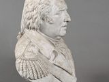 marble bust of a man wearing a suit and tie
