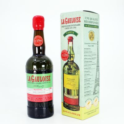 bottles of alcohol are sitting next to each other on a white surface