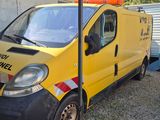 a yellow van that is parked next to a building