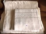a stack of folded linens on a couch