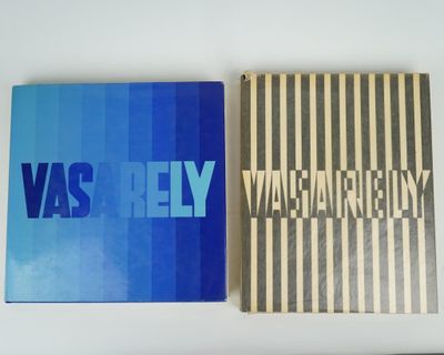 two books sitting on top of a white table next to each other