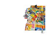 a pile of comic books and a knife on a table