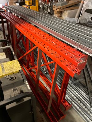 a long metal shelf with a lot of metal items on it