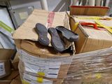 a pile of boxes and a pair of shoes on top of them
