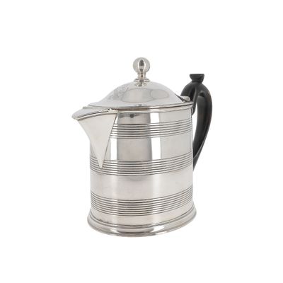 silver plated coffee pot with a black handle on a white background
